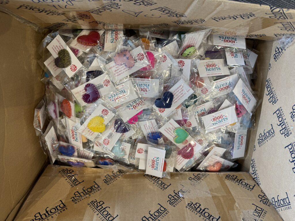 A box of hand sewn felt hearts